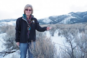 Patti points out a fence marker that helps sage grouse steer clear and avoid potentially fatal fence collisions