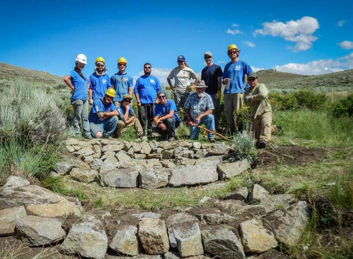 Volunteers building a media luna at Colorado Parks & Wildlife's Kaichen State Habitat Area. Photo: Claudia Strijek/WSCU