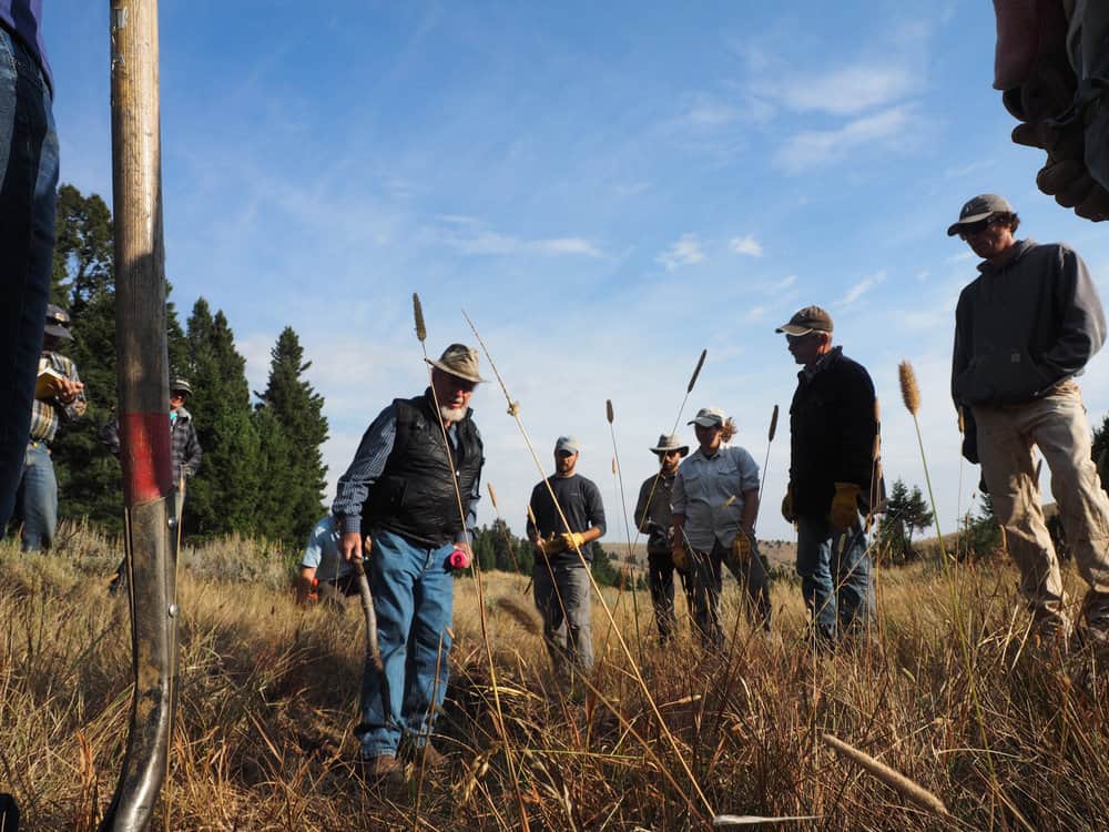 Pictured holding his iconic walking stick, Zeedyk is a riparian restoration expert here to teach Montana managers his unique methods for repairing meadows like this one in sagebrush country.
