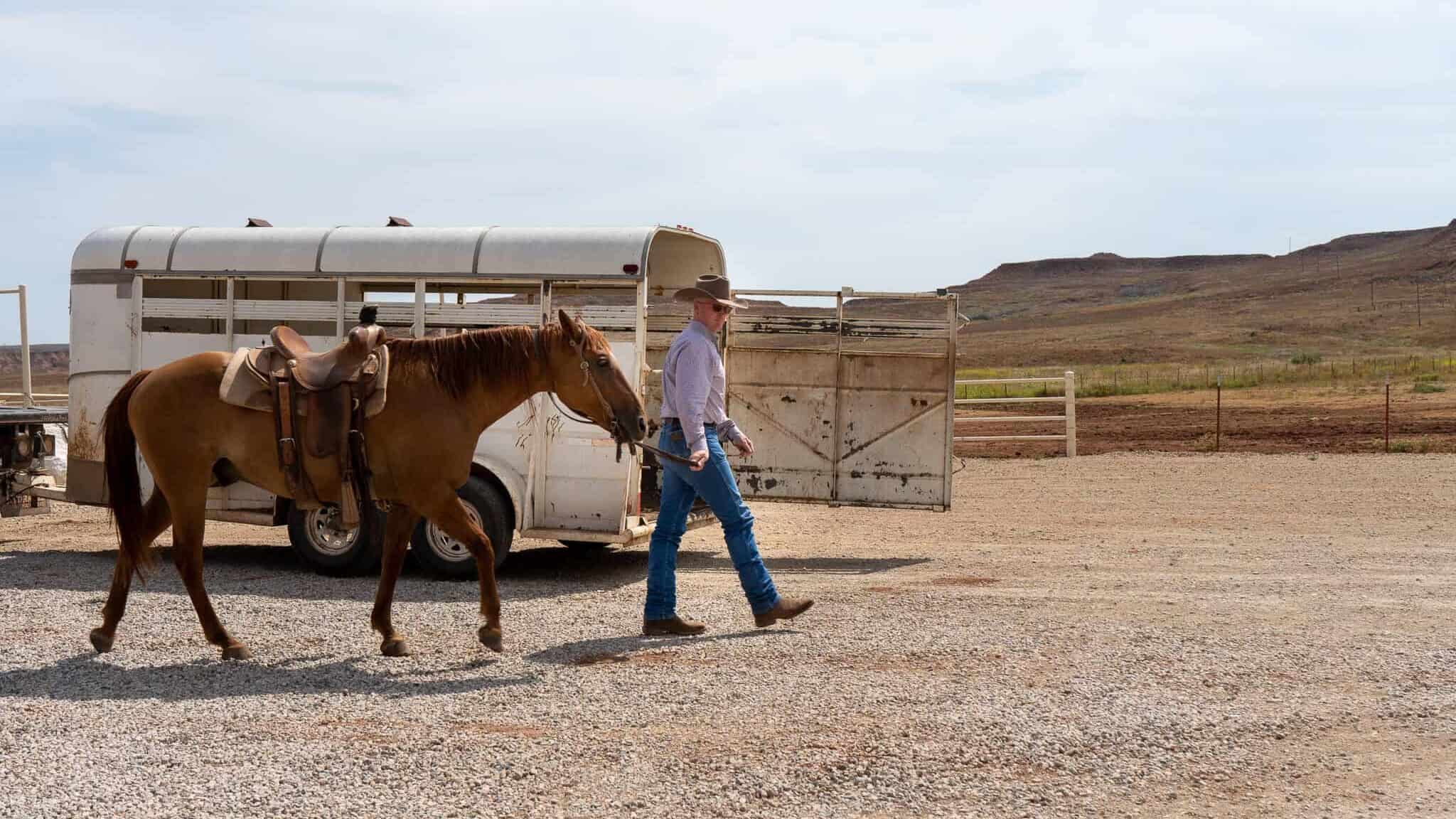 Russell Blew leads a horse on the Nichols Ranch in the Gypsum Hills of south-central Kansas.
